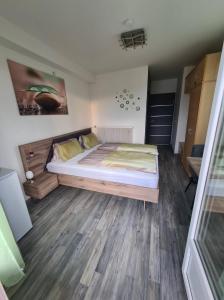 Letto o letti in una camera di Orchidea2