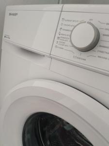 a close up of a washing machine at La casa di Maria in Athens