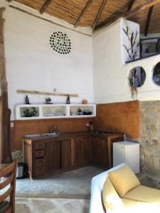a kitchen with a sink and a counter at Zuna in Sutamarchán +22 photos