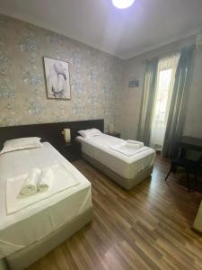 Postel nebo postele na pokoji v ubytování Hotel Guri
