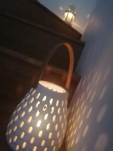 a white vase sitting next to a wall at Historic Centre - Apartment Near Teatro Massimo in Palermo