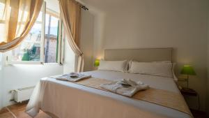 Postel nebo postele na pokoji v ubytování Hotel Can Verdera