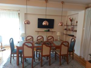 a dining room with a table and chairs at Villa Malina in Donja Raštelica