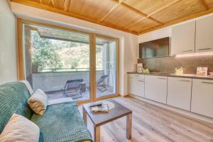 a living room with a couch and a table at Residence Schnals in Senales