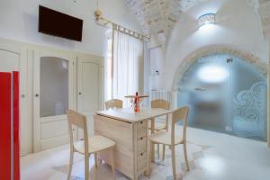 a dining room with a table and chairs at D House in Ceglie Messapica +10 photos