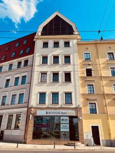 a building with a clock on top of it at Boogie ApartHouse Old Town in Wrocław