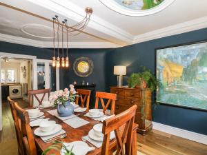 a dining room with a table and chairs at Cuckoo Cottage in Worcester