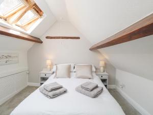 Postel nebo postele na pokoji v ubytování Cuckoo Cottage