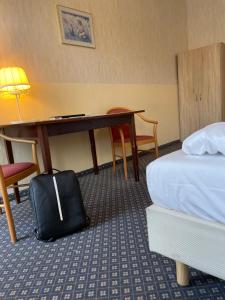 Łóżko lub łóżka w pokoju w obiekcie Hotel Tabor Rooms