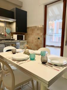a kitchen with a table with plates on it at Home53 in Arezzo