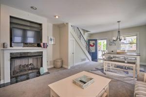 a living room with a fireplace and a tv at Charming Ocean City Townhome Walk to Beach! in Ocean City