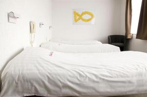 Postel nebo postele na pokoji v ubytování Hotel Halleux