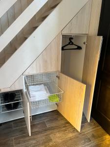 an attic room with a shelf under the stairs at Soko House in Sokolac