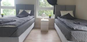 Łóżko lub łóżka w pokoju w obiekcie White Room Wrocław przy Wyspie Opatowickiej