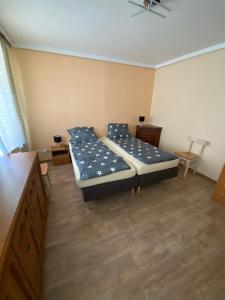 Łóżko lub łóżka w pokoju w obiekcie Ratuszowa Noclegi