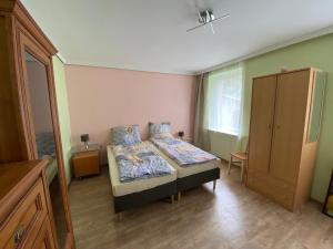 Łóżko lub łóżka w pokoju w obiekcie Ratuszowa Noclegi
