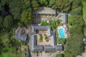 an overhead view of a house with a pool at St Keverne in Budock Water