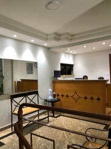 a court room with a bench and a desk at Hotel Varginha I in Varginha