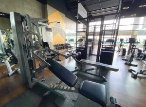 a gym with several treadmills and machines at Midtown Cebu City Condo in Cebu City