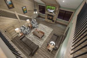 an overhead view of a living room with furniture and a tv at Smoky Pines Chalet - Free Putt-Putt Course! chalet in Gatlinburg +52 photos