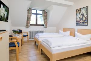 Postel nebo postele na pokoji v ubytování Gästehaus Goethe