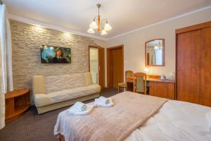 Ένα ή περισσότερα κρεβάτια σε δωμάτιο στο Hotel Diament