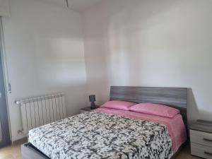 Łóżko lub łóżka w pokoju w obiekcie La dolce vita