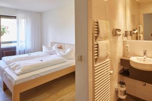 Postel nebo postele na pokoji v ubytování Gästehaus Goethe