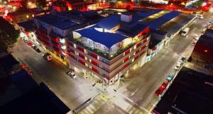 an overhead view of a large building with a parking lot at Kasa Hotel & Suites in Irapuato
