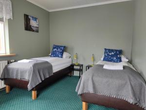 Rúm í herbergi á 550 Guesthouse
