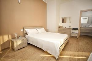 Posteľ alebo postele v izbe v ubytovaní B&B Bouganville