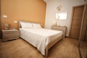 Posteľ alebo postele v izbe v ubytovaní B&B Bouganville