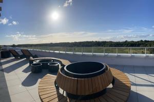 a row of benches sitting on top of a roof at Polanki Aqua A204 in Kołobrzeg