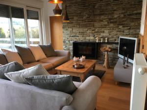 TV a/nebo společenská místnost v ubytování Maison Castor