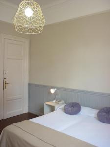 Een bed of bedden in een kamer bij Hotel Du Helder