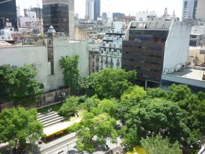 a view of a city with trees and buildings at Hotel Du Helder in Buenos Aires