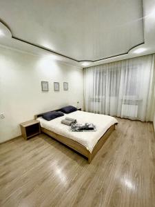 Cama o camas de una habitación en Роскошные апартаменты в центре