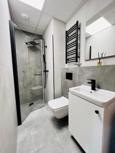 Koupelna v ubytování CozyStudio with Sauna