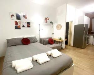 a bedroom with a bed with two pillows on it at Bed&Coffee Milano in Milan
