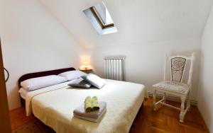 Posteľ alebo postele v izbe v ubytovaní Apartments Alan