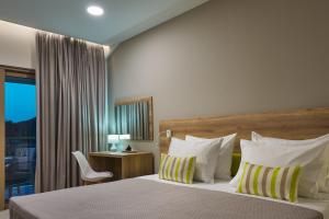 Letto o letti in una camera di Grapevines Hotel