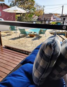 a person with their feet up on a blue blanket at Mar de Maria Pousada in Búzios