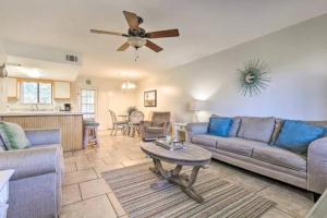 a living room with a couch and a ceiling fan at Resort gem w/ 2-bedrooms and easy walk to beach in Panama City Beach