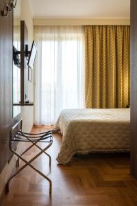 a hotel room with a bed and a window at Grande Albergo in Sestri Levante