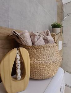 a basket of towels sitting on top of a table at Malta Premium Apartment, free parking, self check-in 24h in Poznań