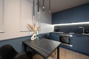 Kuchyň nebo kuchyňský kout v ubytování Tare apartment + 12 fotografií