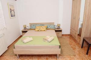 Posteľ alebo postele v izbe v ubytovaní Apartman Bingo