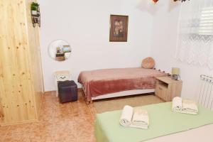 Posteľ alebo postele v izbe v ubytovaní Apartman Bingo