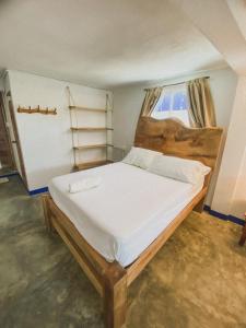 a large bed in a room with a window at Mamallena Beachside Rincon del Mar in Rincón +77 photos