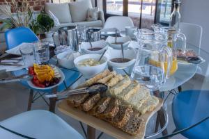 a table with a buffet of food on it at Hostal-Casa Rural Rosa-Nonna in Sigüenza